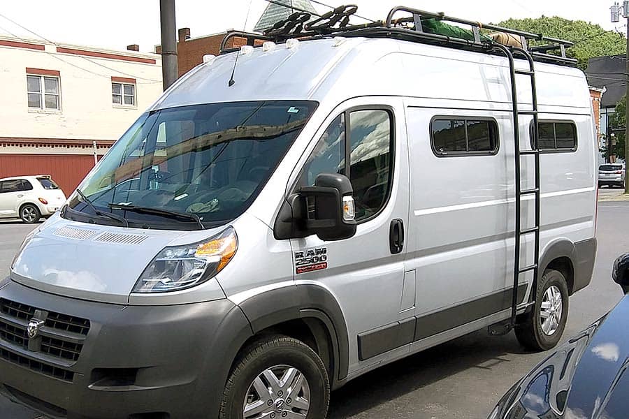 Silver Ram camper van with ladder to roof rack