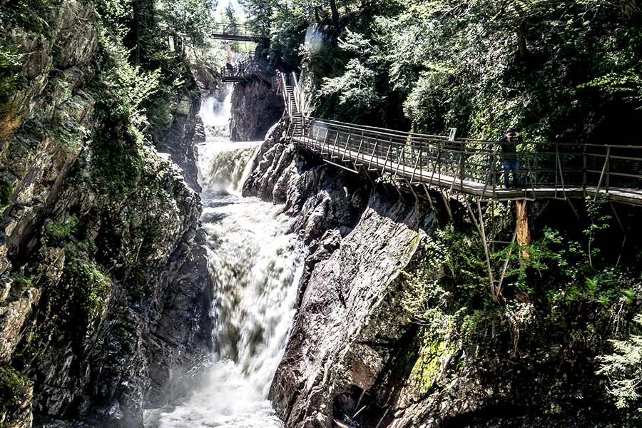 Wooden walkway along the side of Ausable Chasm waterfall