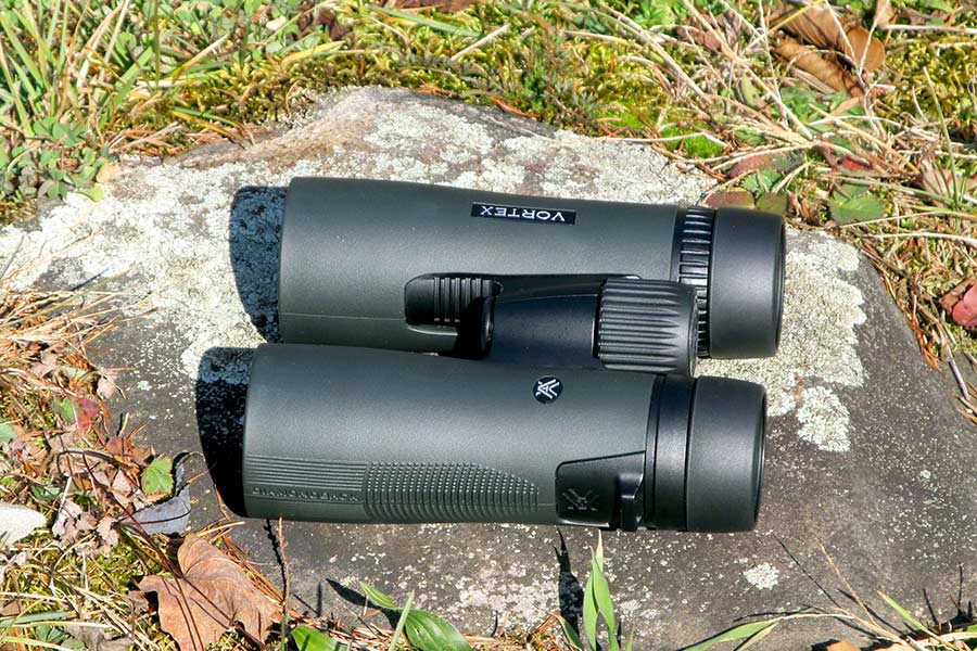 Binocular on rock in grass