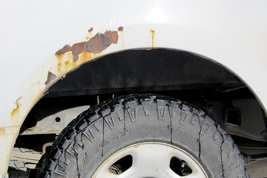 Paint peeling and rust starting over van wheel well