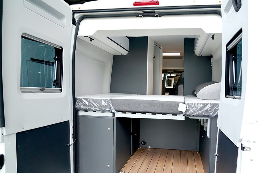 Looking inside a new camper van from the back end