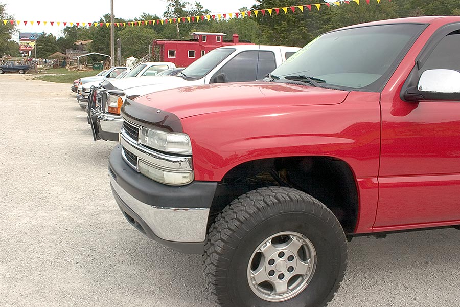 Row of pickup trucks on lot