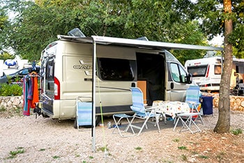 Camper van parked at campsite