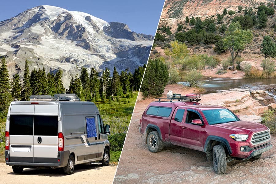 Silver van in front of mountains and a red truck parked on dirt