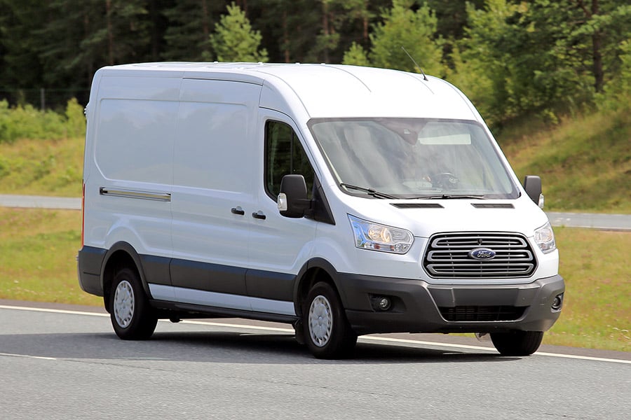 A white van going down highway