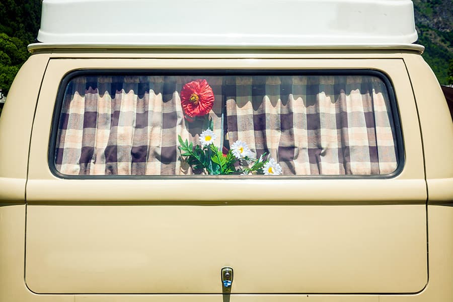 Plaid curtains in back window of van