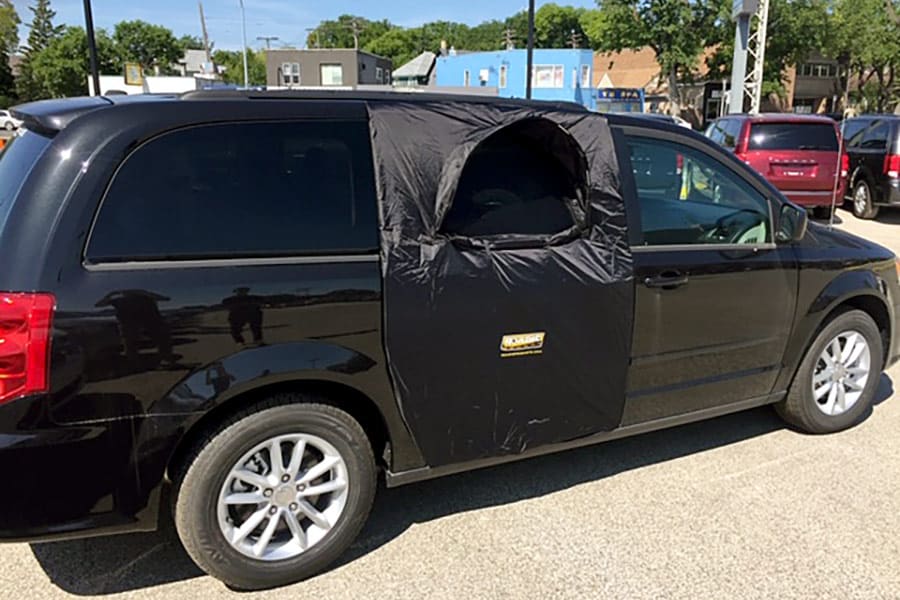 A black Roadie screen over a van door