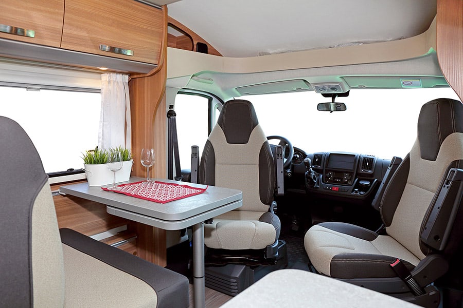 Interior of a camper van with table and chairs