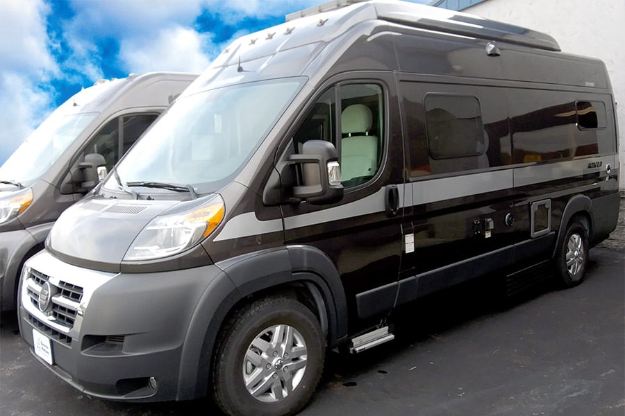 Black Class B RV parked on blacktop