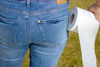 Person holding toilet paper