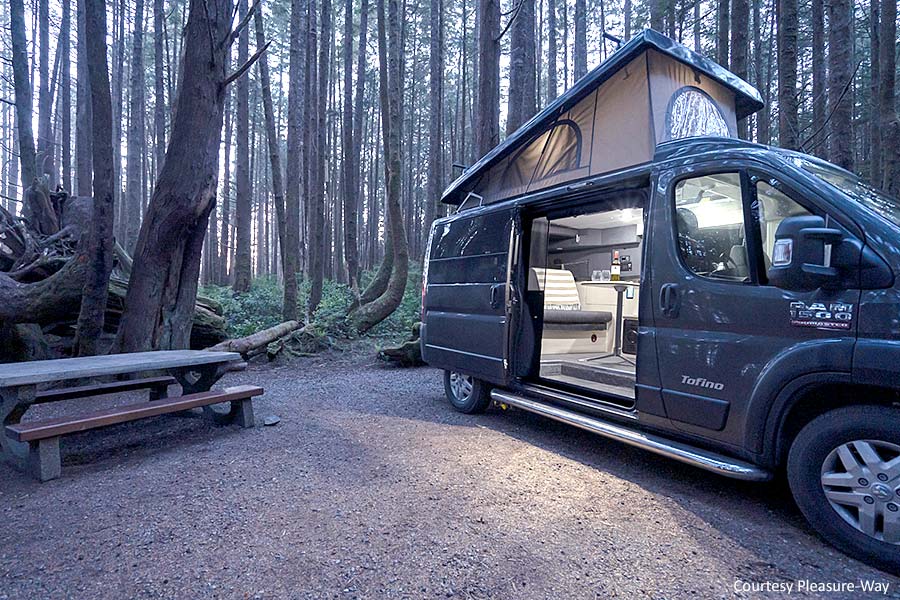 A Tofino Class B parked in the woods