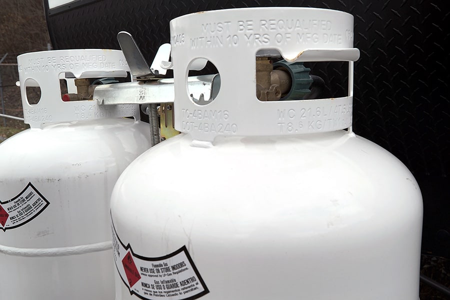 Closeup of the tops of two propane tanks