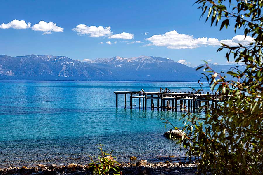 Beautiful blue water with mountains in the background