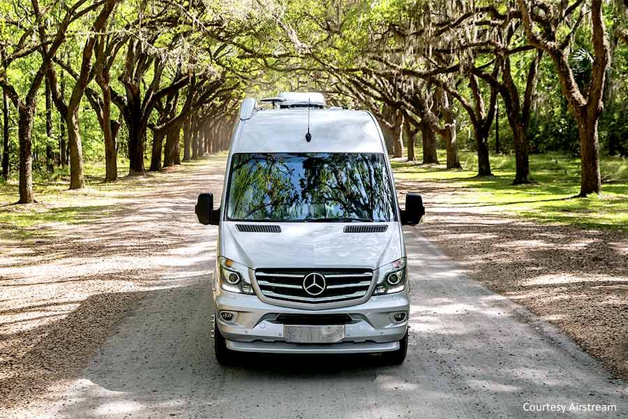 Airstream Interstate van driving on gravel road