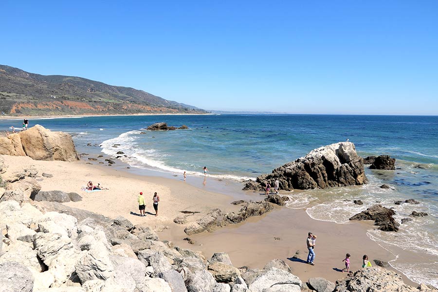People walking the shoreline at Leo Carrillo State Beach