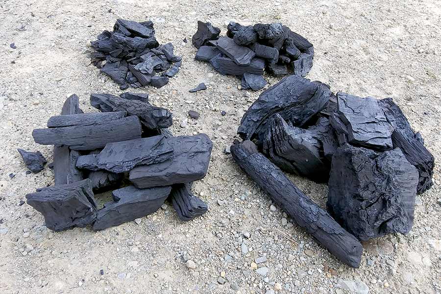 Different sizes of lump charcoal in one bag