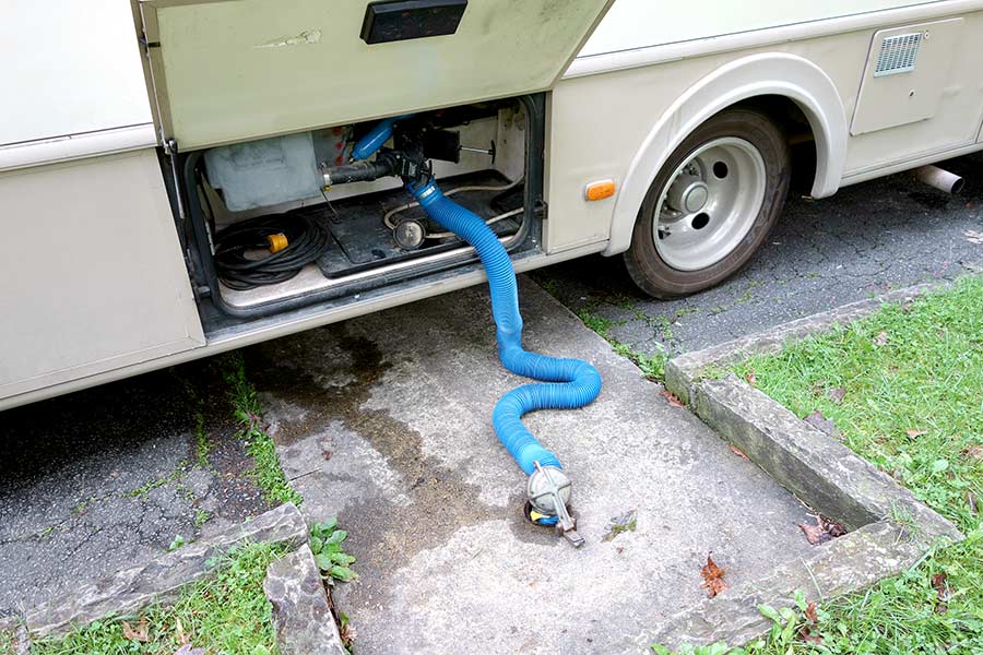 Emptying RV holding tank at dump station