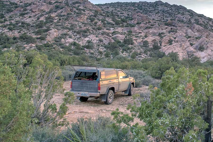 Older truck parked in Nevada off-road setting