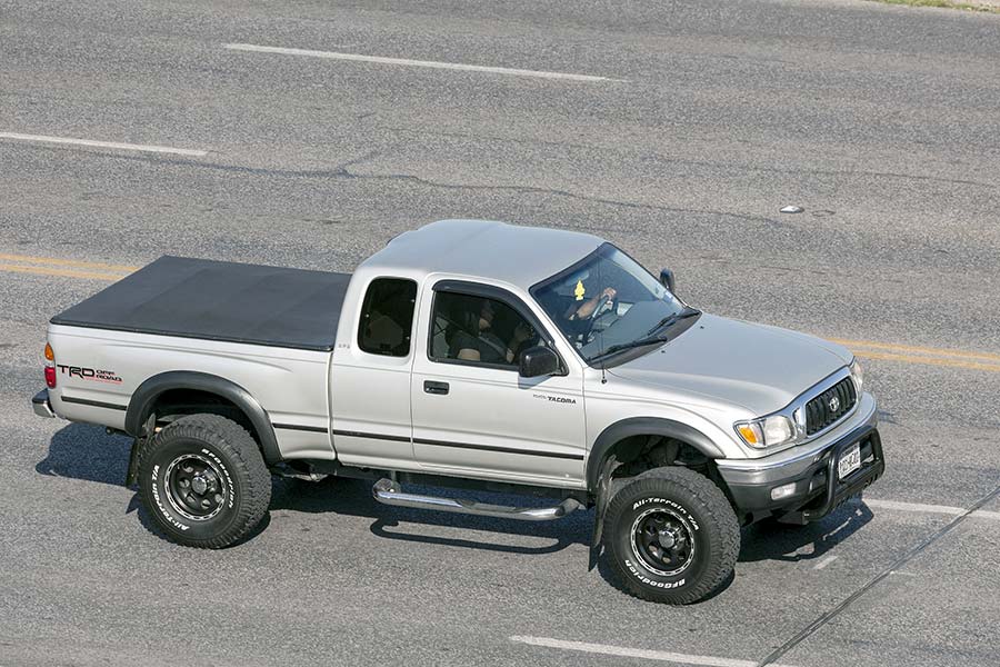 Silver Toyota truck on highway