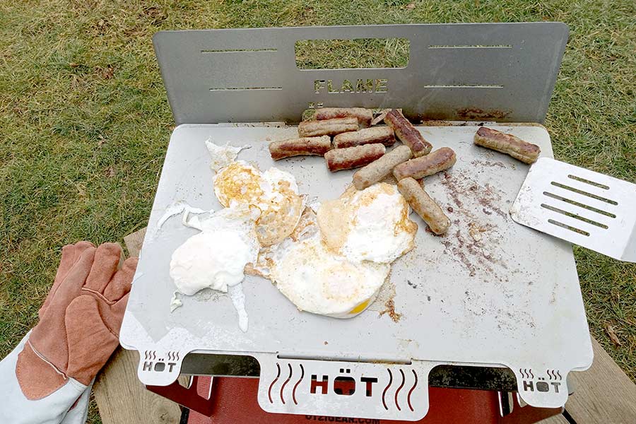 Eggs and sausage on grill ready to eat