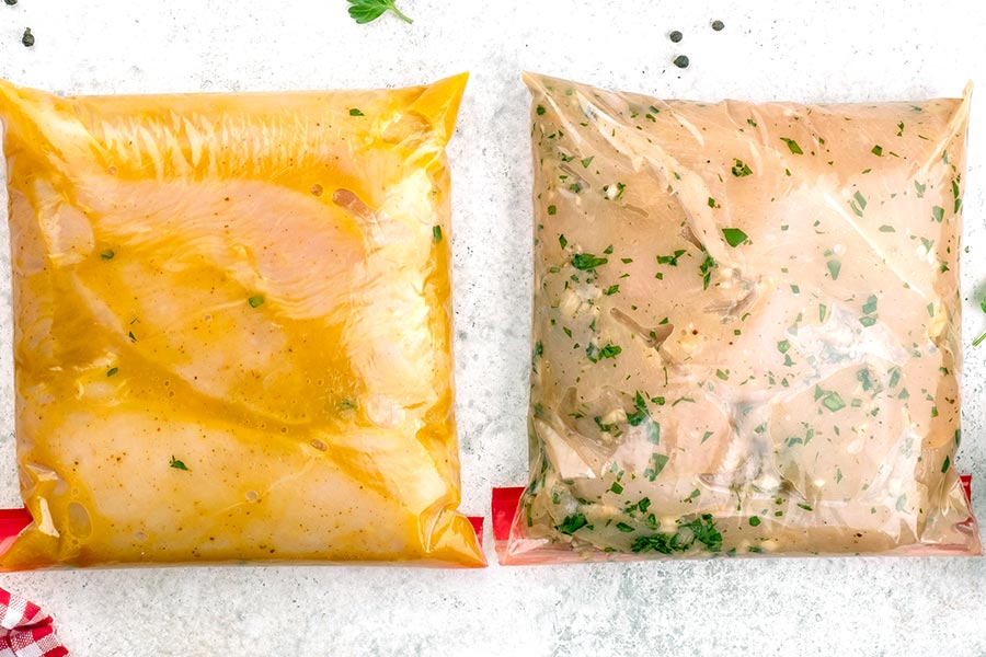 Marinated chicken breasts in plastic bags