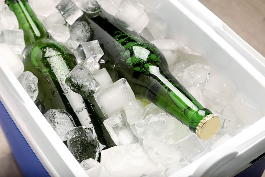 Cooler filled with ice and beer