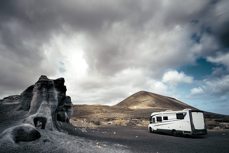 RV parked in remote area with thunderstorm coming