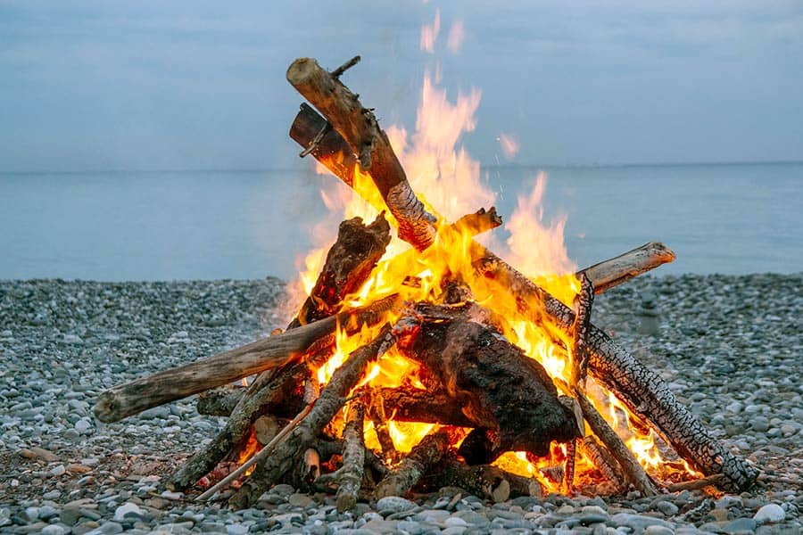 Roaring campfire on beach