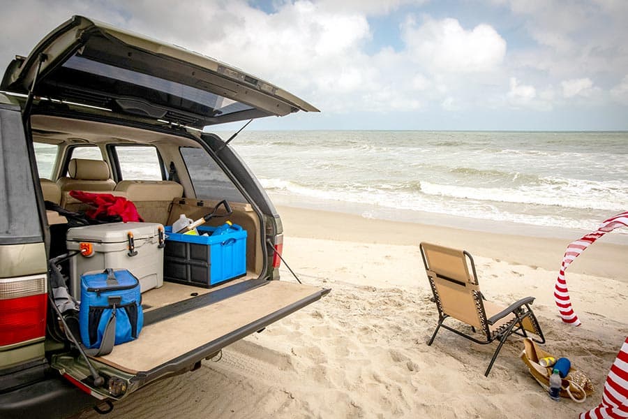 An SUV loaded with cooler and other supplies