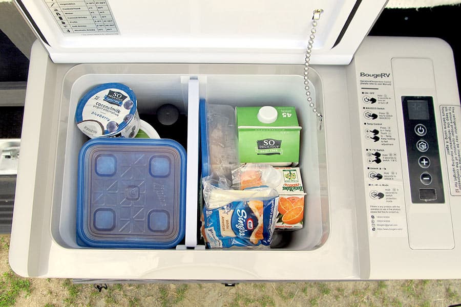 Looking at food in portable refrigerator