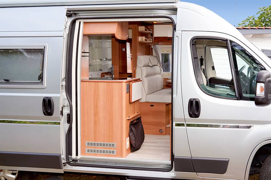 Gray camper van with side door open