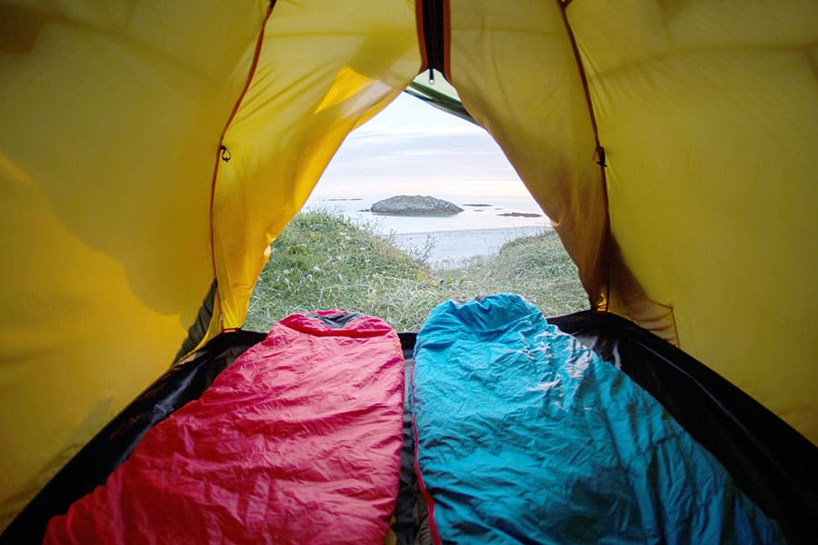 Looking at ocean through tent doorway