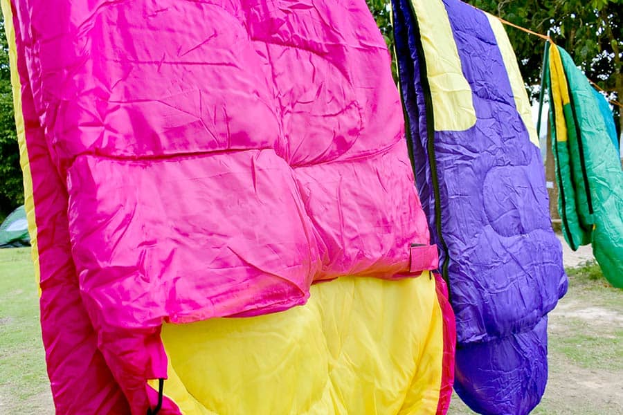 Drying sleeping bags on a rope at campsite