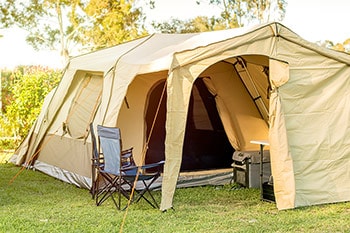 Large tan tent with chairs