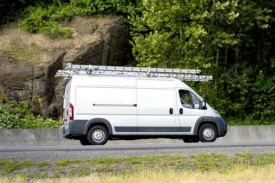 Cargo van with ladders on the roof