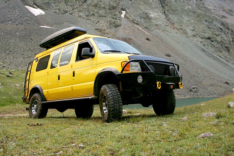 Yellow camper van in the Rocky Mountains, Colorado