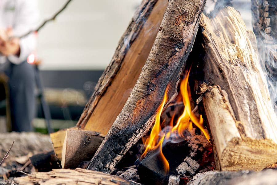 A teepee or cone shaped campfire