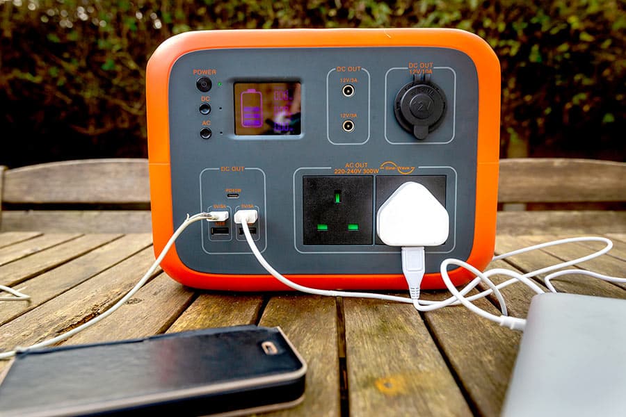 Power pack on wooden picnic table