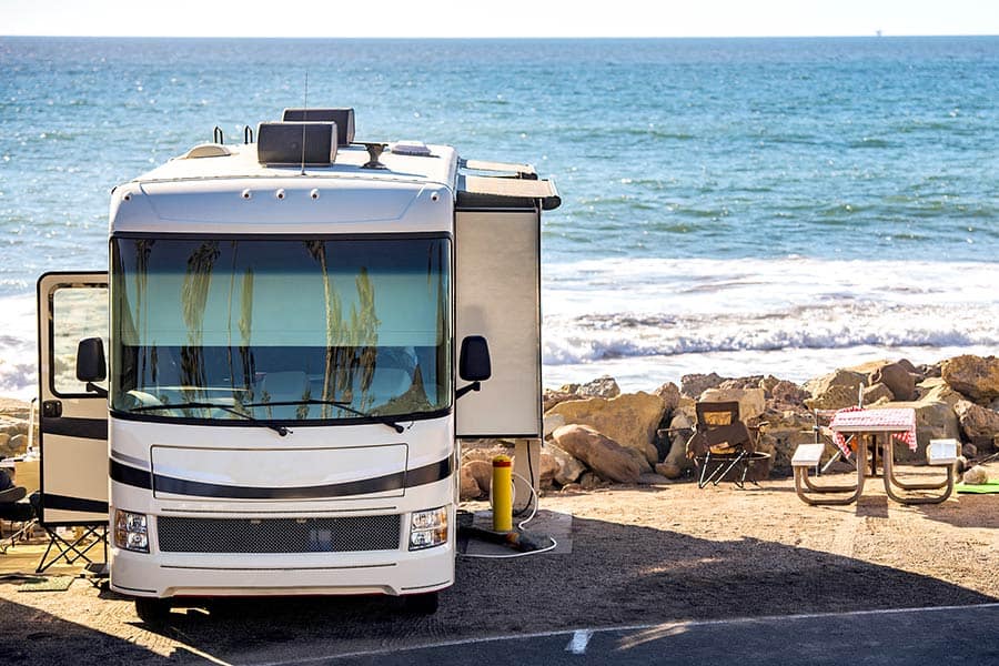 Class A motorhome parked at seashore campground