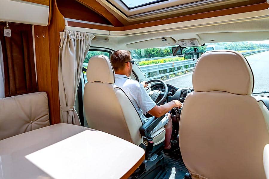 Man test driving a motorhome  to see if he wants to purchase it