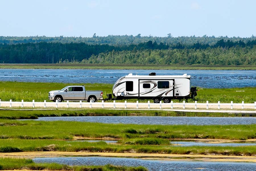 Pickup truck towing a camper trailer