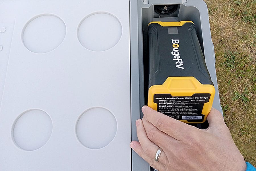 Placing the battery into the  refrigerator compartment space