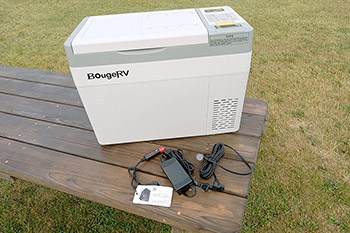 Portable fridge on picnic table